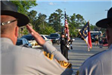 Law Enforcement saluting flag