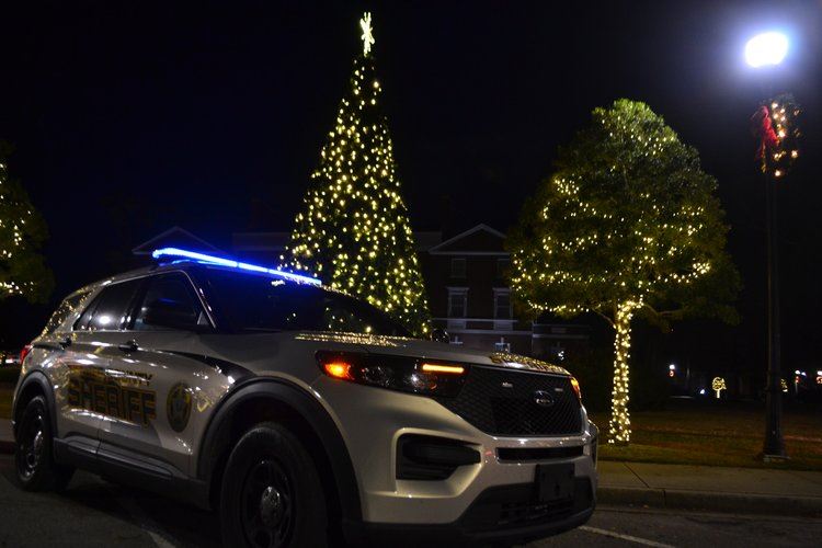 Sheriff Cruiser next to Christmas lights