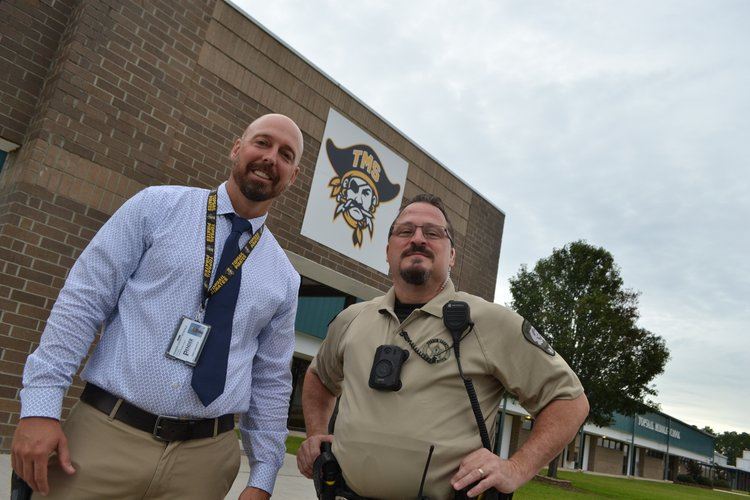 Standing outside high school