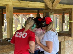 Instructors helping student